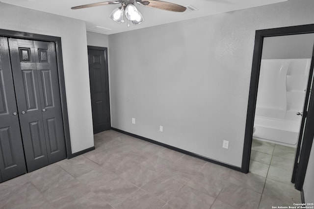 unfurnished bedroom with a closet and ceiling fan