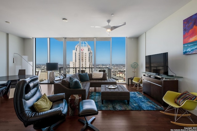 living room featuring floor to ceiling windows, ceiling fan, and dark hardwood / wood-style flooring