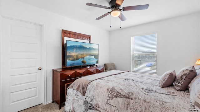 bedroom with ceiling fan and carpet floors