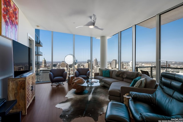 living room featuring hardwood / wood-style flooring, floor to ceiling windows, and ceiling fan