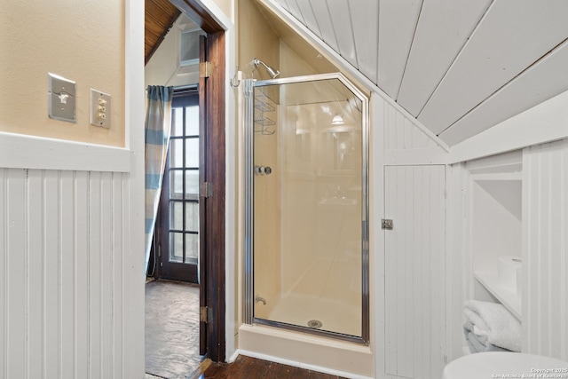 bathroom featuring vaulted ceiling, walk in shower, and wood ceiling