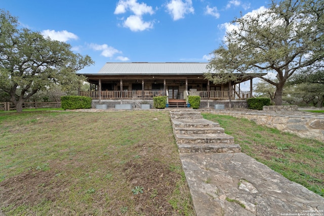 country-style home with a porch and a front yard