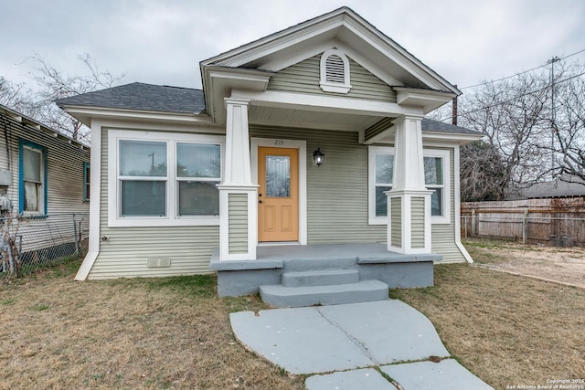 view of front facade with a porch and a front lawn