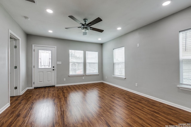 foyer entrance featuring plenty of natural light, dark hardwood / wood-style floors, and ceiling fan