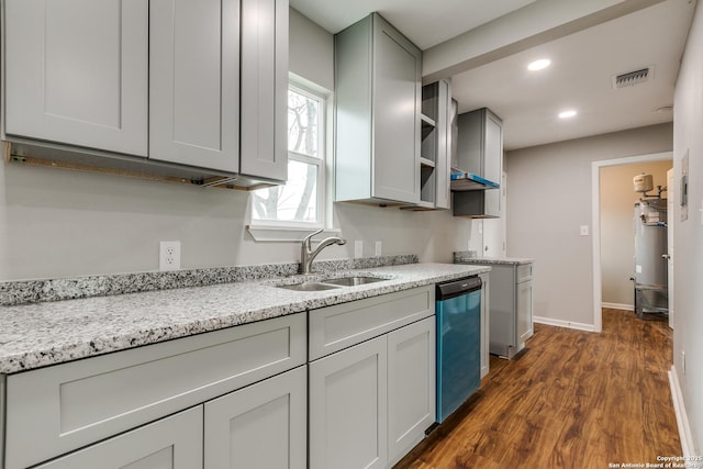 kitchen with sink, light stone countertops, dark hardwood / wood-style floors, and dishwasher