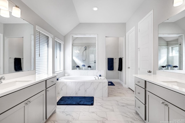 bathroom with lofted ceiling, plus walk in shower, and vanity