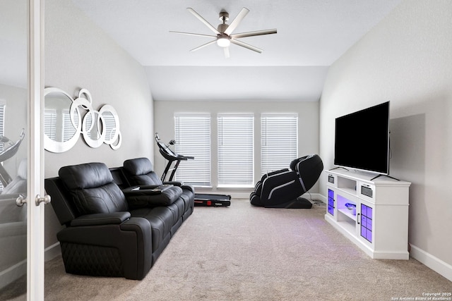 living room featuring lofted ceiling, carpet floors, and ceiling fan