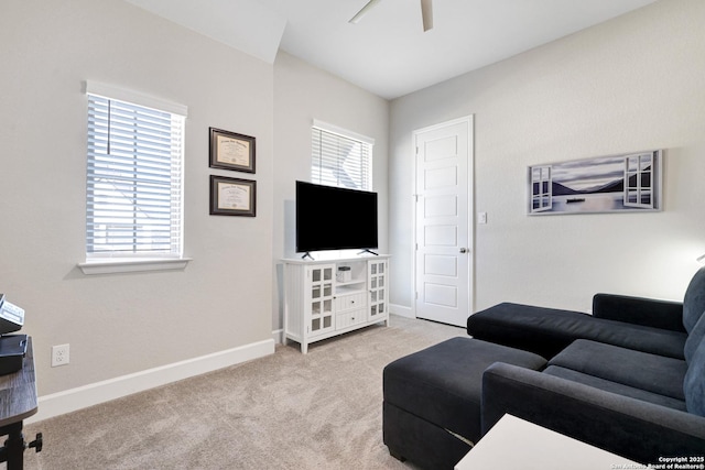 living room with light carpet and ceiling fan