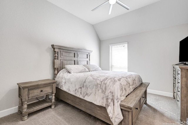 carpeted bedroom featuring lofted ceiling and ceiling fan