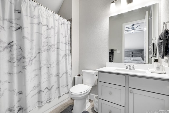 full bathroom with vanity, shower / bath combo with shower curtain, ceiling fan, and toilet