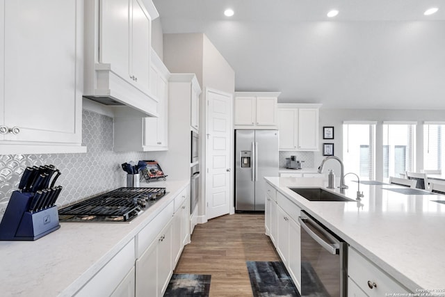 kitchen featuring white cabinetry, sink, dark hardwood / wood-style floors, and appliances with stainless steel finishes