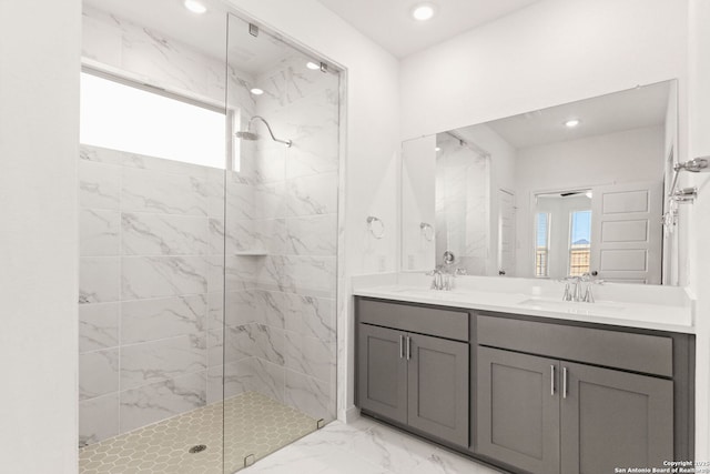 bathroom featuring vanity and a tile shower