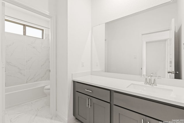 full bathroom featuring vanity, toilet, and tiled shower / bath