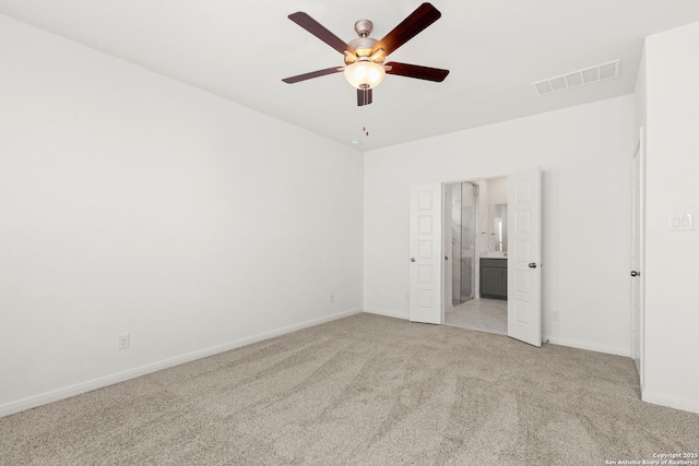 carpeted empty room featuring ceiling fan