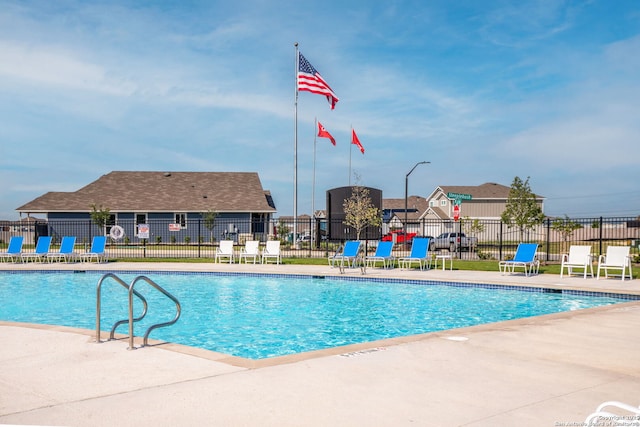 view of swimming pool with a patio area