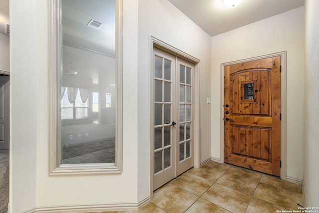 tiled foyer with french doors