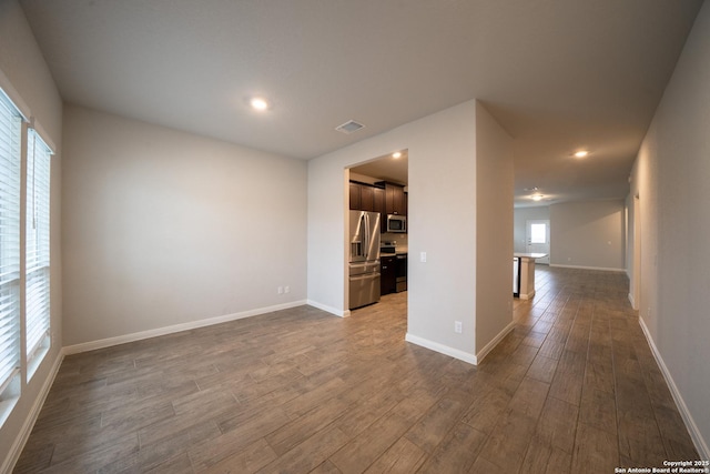 spare room featuring hardwood / wood-style flooring