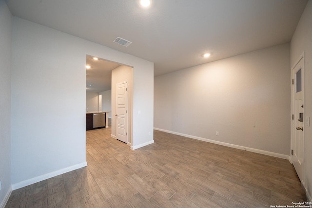 spare room with light hardwood / wood-style flooring