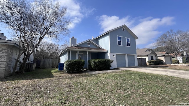 view of front of property with a garage and a front yard