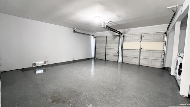 garage featuring independent washer and dryer