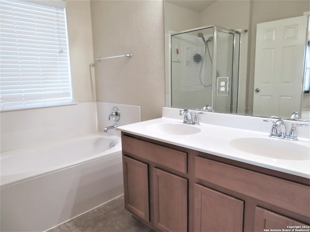 bathroom featuring vanity, tile patterned floors, and shower with separate bathtub