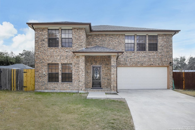 view of front of house with a garage and a front lawn