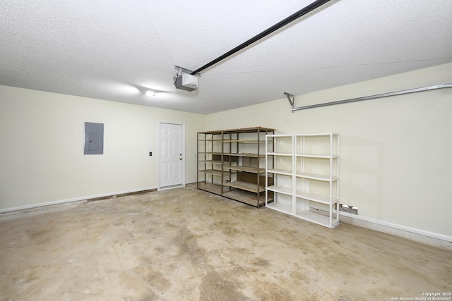 garage with a garage door opener and electric panel