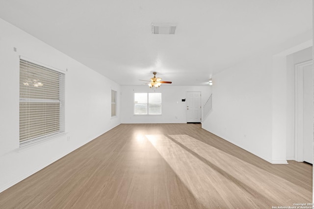 unfurnished living room with ceiling fan and light hardwood / wood-style flooring