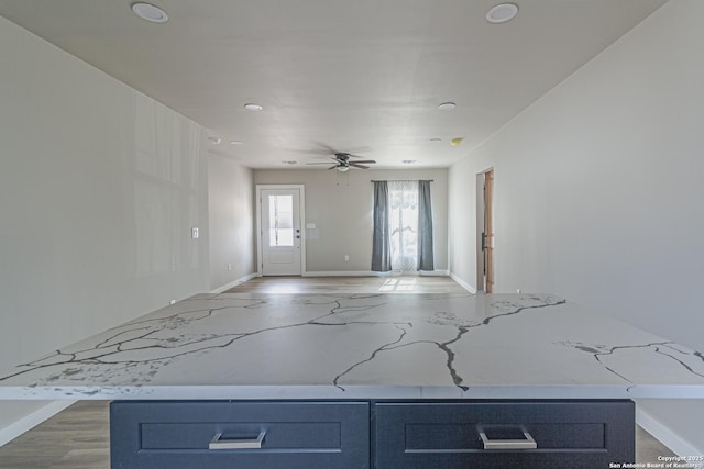 interior space featuring ceiling fan