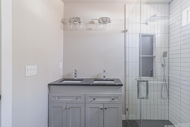 bathroom featuring walk in shower and vanity