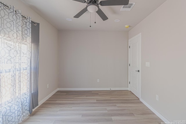 empty room featuring light hardwood / wood-style floors and ceiling fan