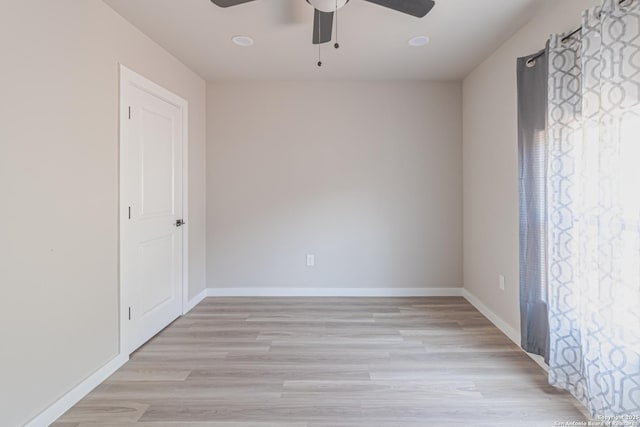 unfurnished room featuring ceiling fan and light hardwood / wood-style flooring