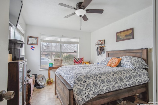 bedroom with light tile patterned floors and ceiling fan