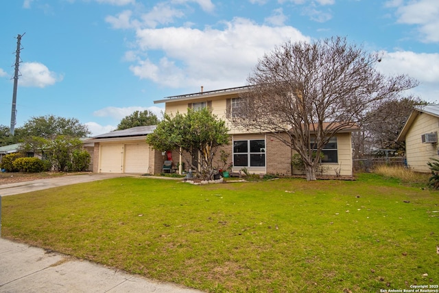 view of front property featuring a garage, a front lawn, and solar panels