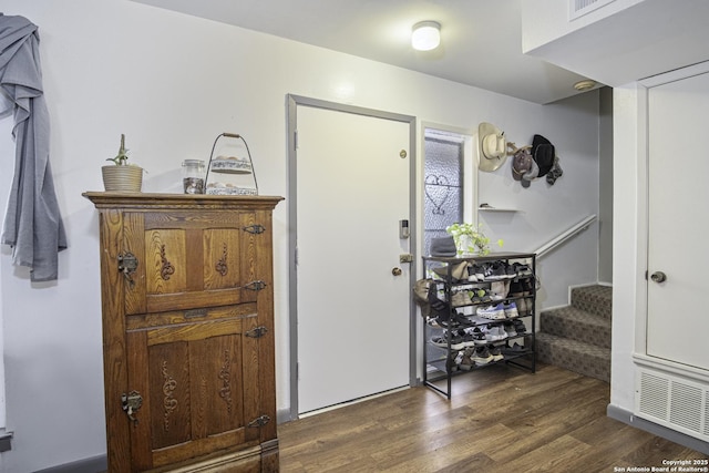 entrance foyer with dark hardwood / wood-style flooring