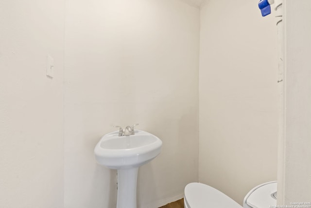 bathroom featuring toilet