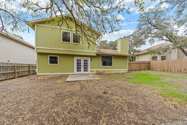 rear view of property with french doors