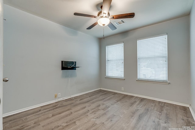 unfurnished room featuring ceiling fan and light hardwood / wood-style flooring