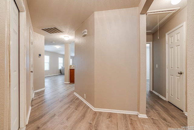 corridor featuring light hardwood / wood-style floors