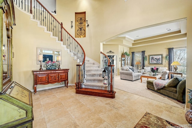 9014 Woodland Pass, Boerne, TX 78006 - interior space featuring arched walkways, baseboards, and a towering ceiling
