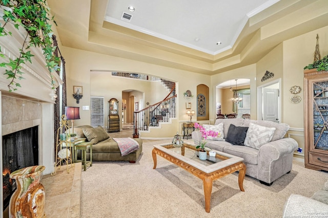 9014 Woodland Pass, Boerne, TX 78006 - living room featuring visible vents, arched walkways, stairway, an inviting chandelier, and ornamental molding