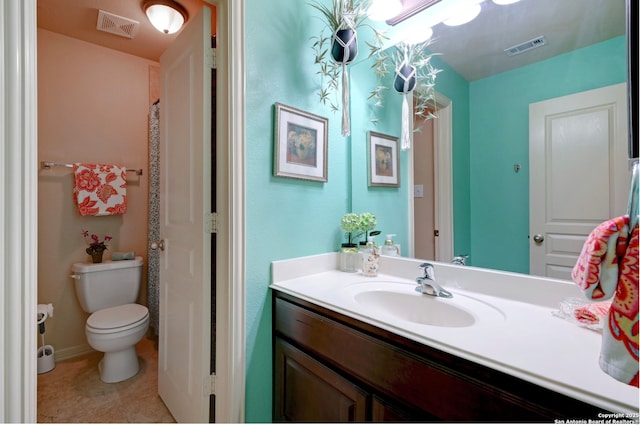 9014 Woodland Pass, Boerne, TX 78006 - bathroom featuring visible vents, tile patterned flooring, toilet, and vanity