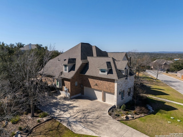 9014 Woodland Pass, Boerne, TX 78006 - view of home's exterior with an attached garage, driveway, and a shingled roof