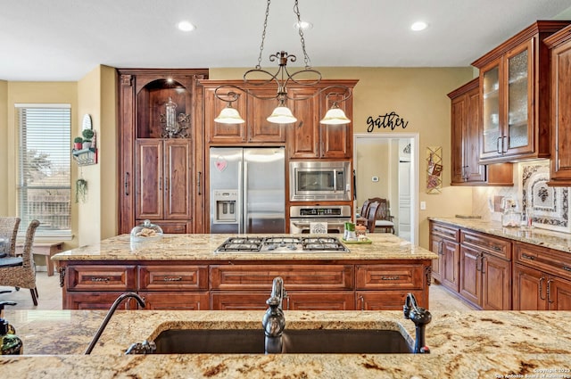 9014 Woodland Pass, Boerne, TX 78006 - kitchen featuring light stone countertops, recessed lighting, a sink, appliances with stainless steel finishes, and backsplash