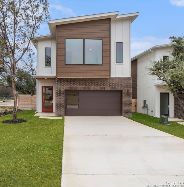 modern home with a garage and a front yard