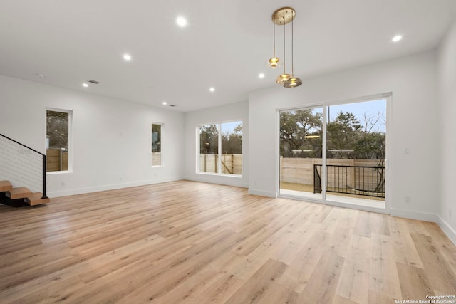 unfurnished living room featuring light hardwood / wood-style flooring