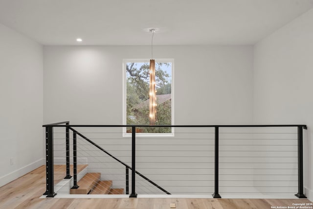 staircase featuring wood-type flooring