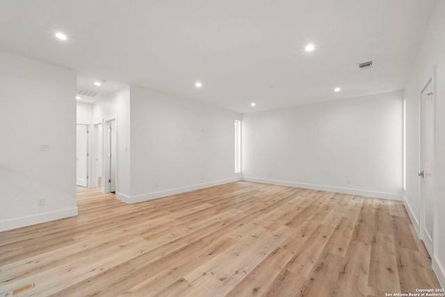 spare room with light hardwood / wood-style flooring