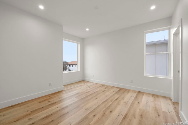 unfurnished room featuring light wood-type flooring