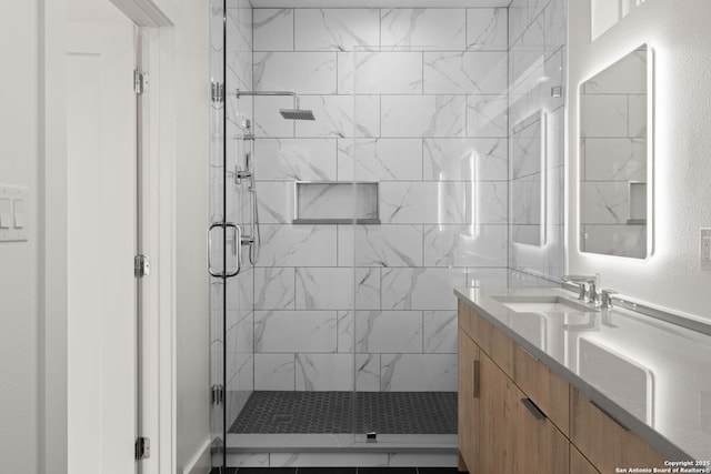 bathroom with vanity and an enclosed shower